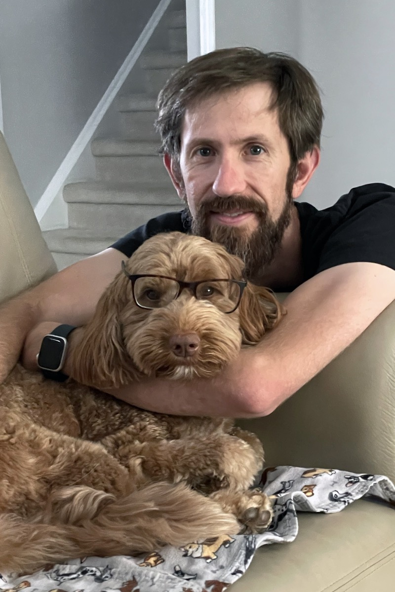 Andrew Judd wearing glasses with his dog — freelance Laravel and full-stack web developer